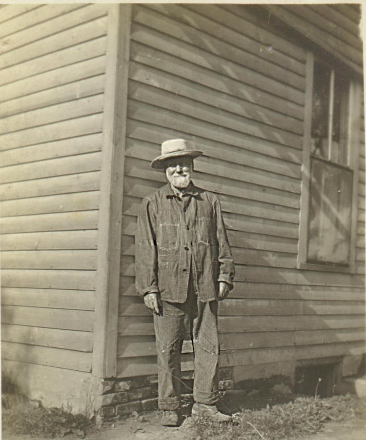 My great great grandfather, William Cornall, standing in front of a structure